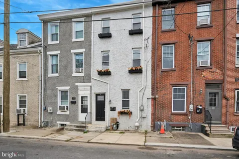 a front view of a building with street