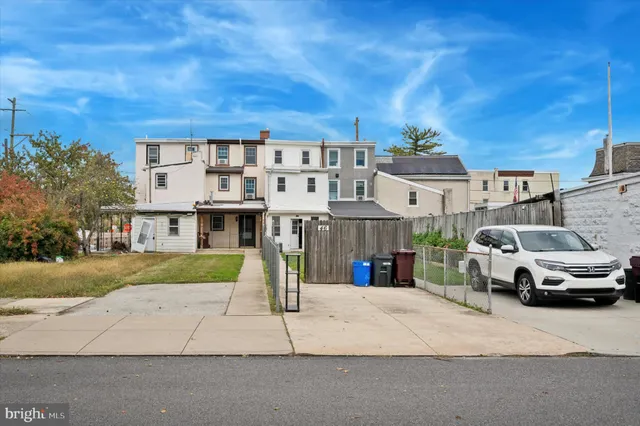 a view of multiple houses with a street