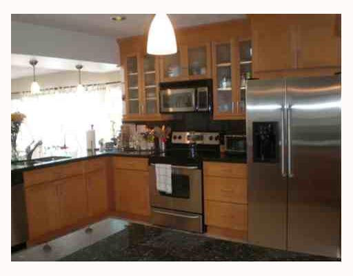 4315 Harrison Street Hollywood, FL 33021 - Photo 2 of 10 a kitchen with stainless steel appliances granite countertop a refrigerator and a sink