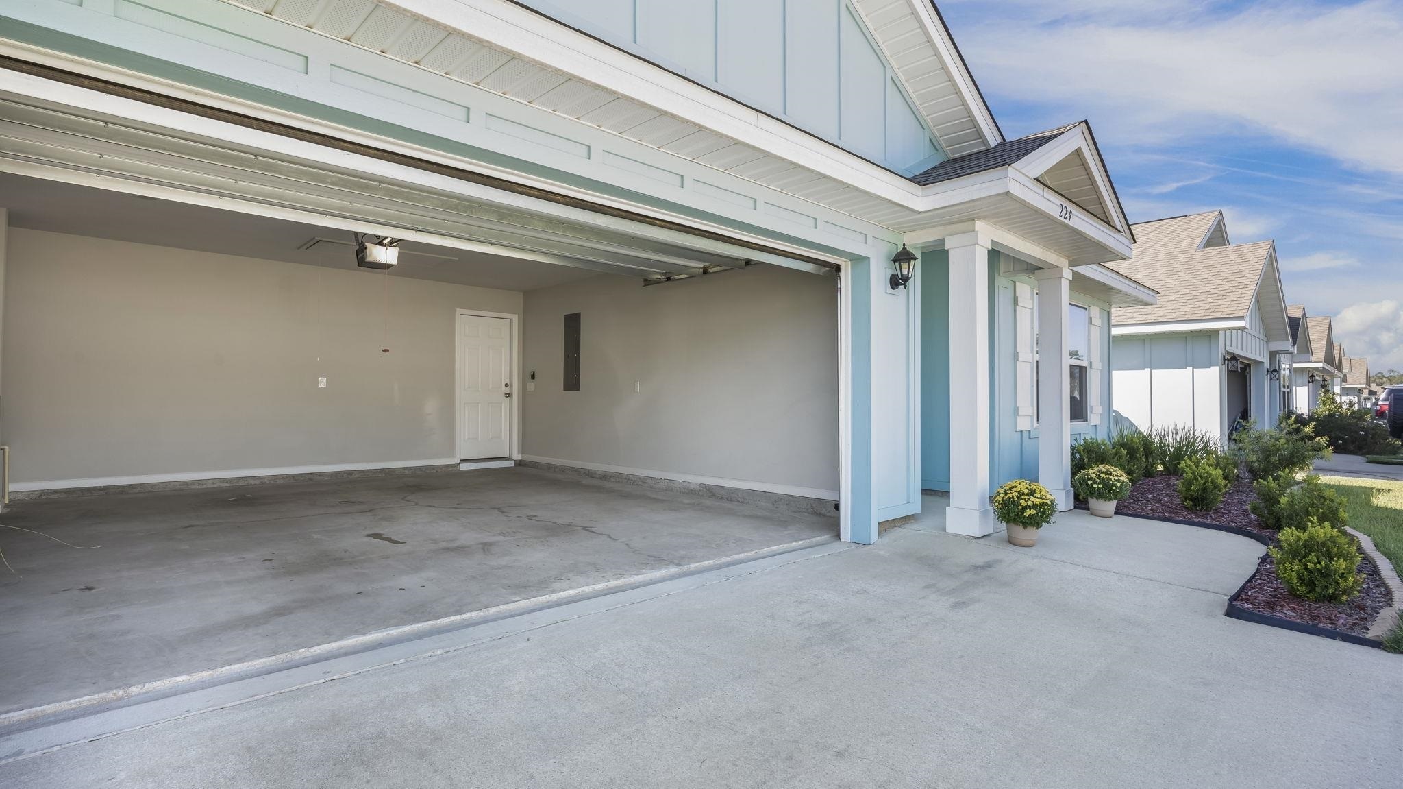 224 Burnston Way Foley, AL 36535 - Photo 39 of 42 Garage featuring electric panel and concrete driveway