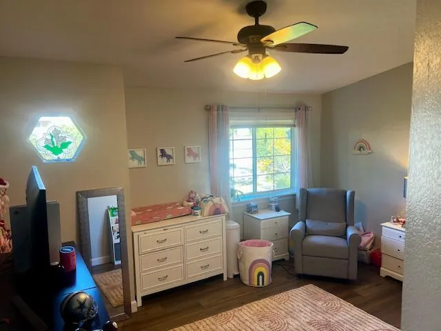 a bedroom with furniture and a window