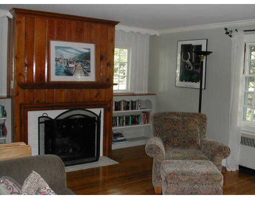 11 Tamarac Road Newton, MA 02464 - Photo 3 of 9 a living room with furniture and a fireplace