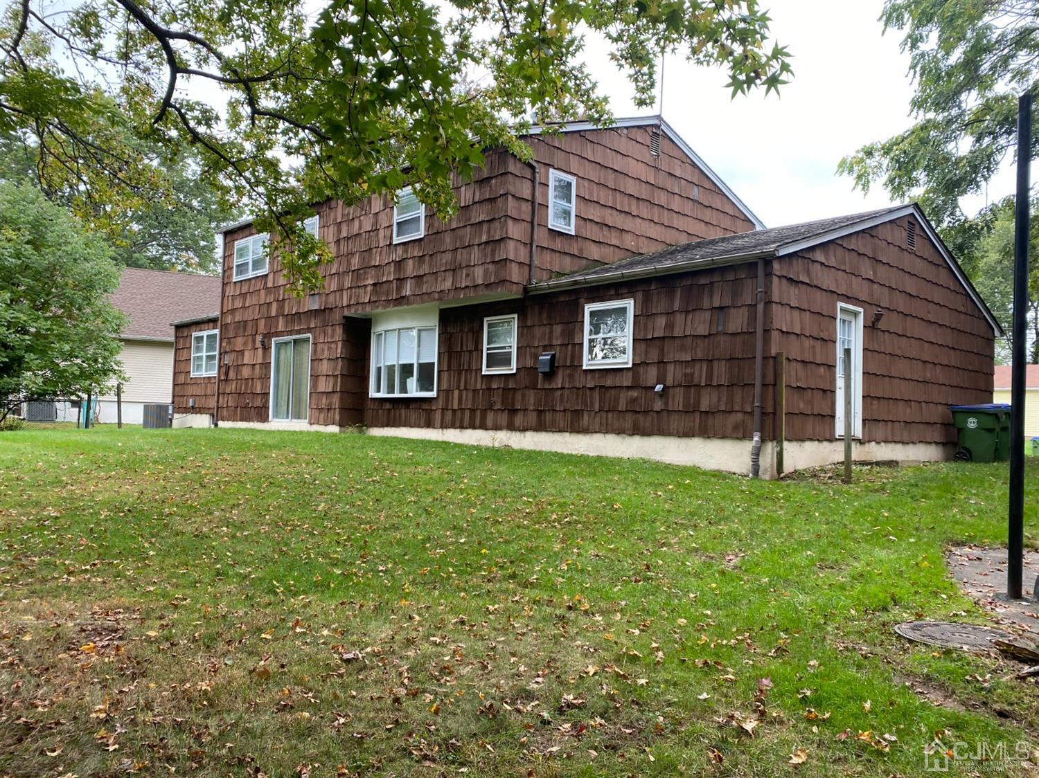 28 Lynnwood Road Edison, NJ 08820 - Photo 4 of 8 a front view of a house with a garden
