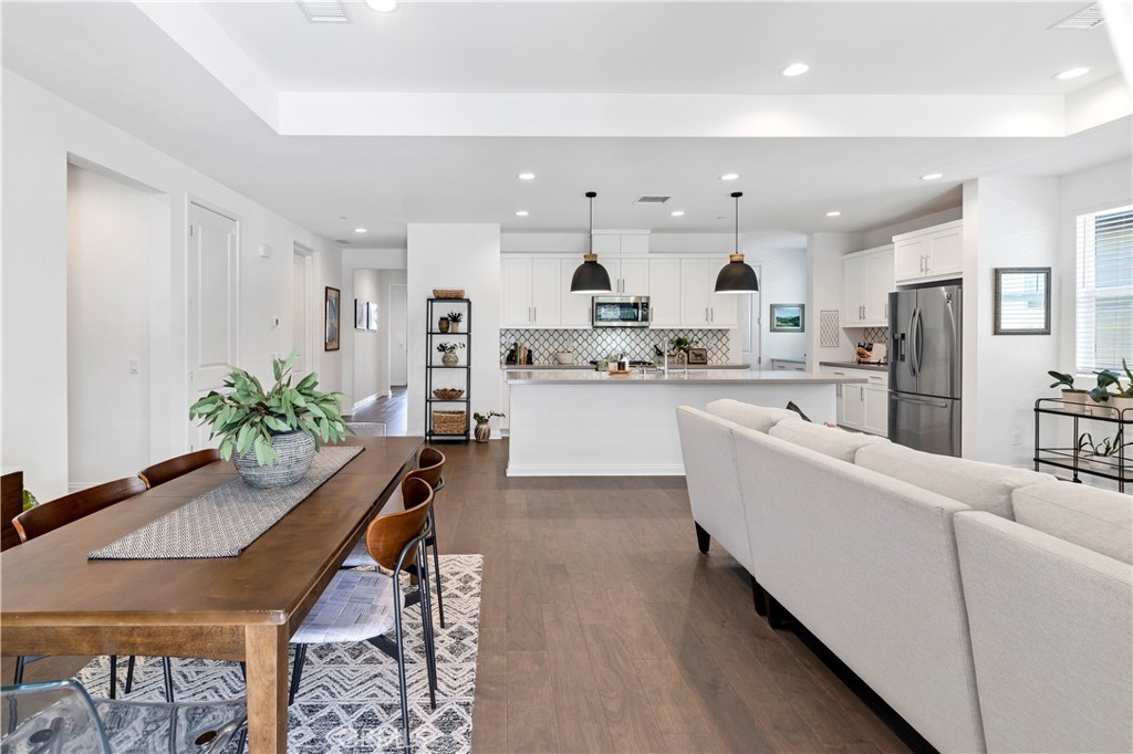 32037 Sedge Way Temecula, CA 92591 - Photo 8 of 61 a living room with stainless steel appliances kitchen island granite countertop furniture and a kitchen view