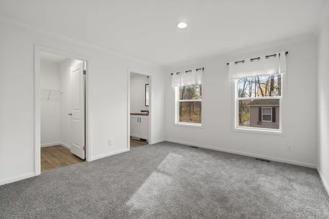 a view of front door with wooden floor