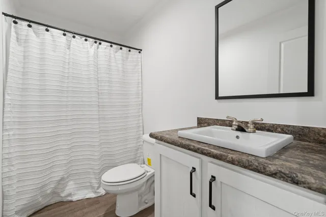 a view of a kitchen with a sink and a window
