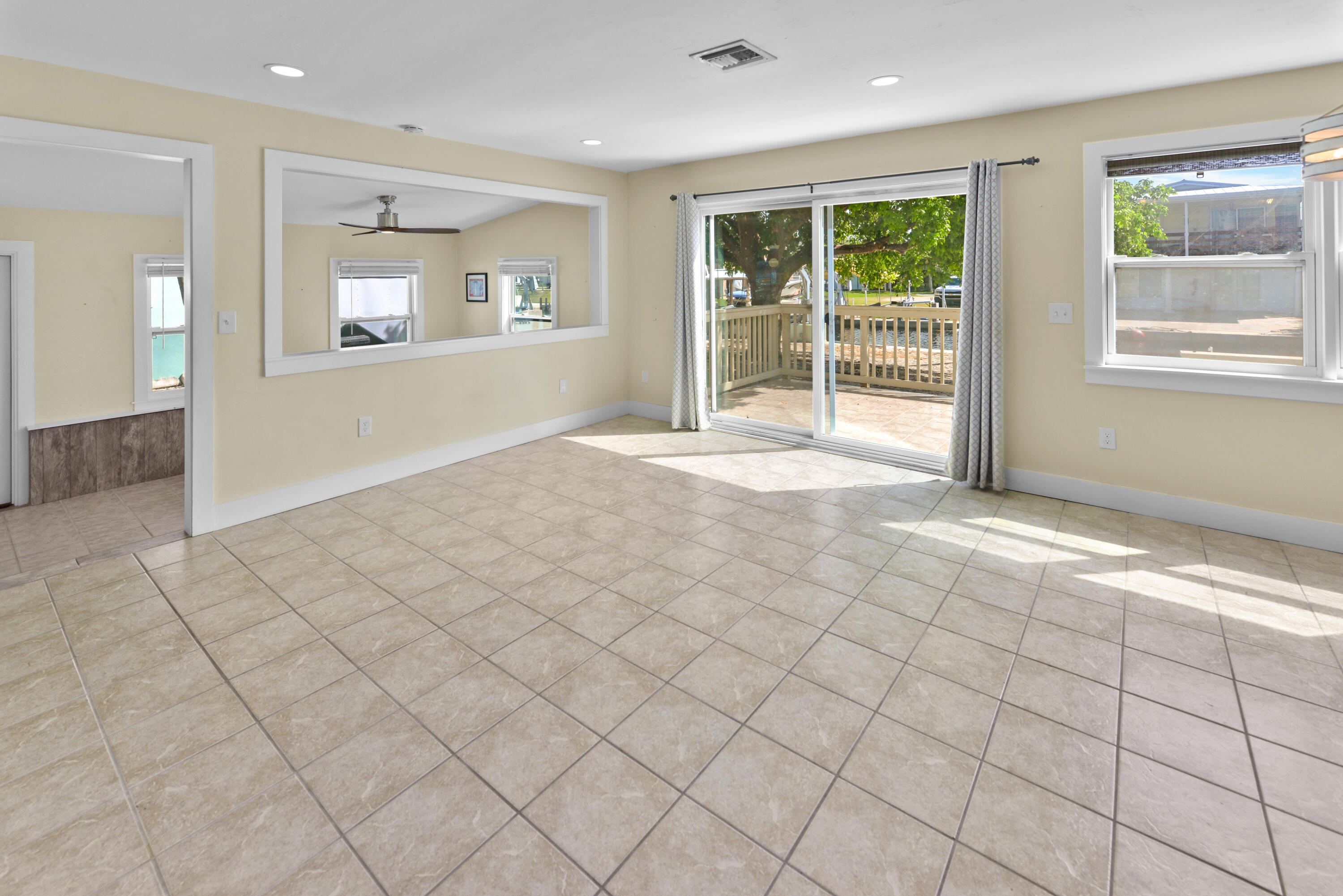 30868 Malaga Lane Big Pine Key, FL 33043 - Photo 15 of 34 an empty room with windows and view of an empty room