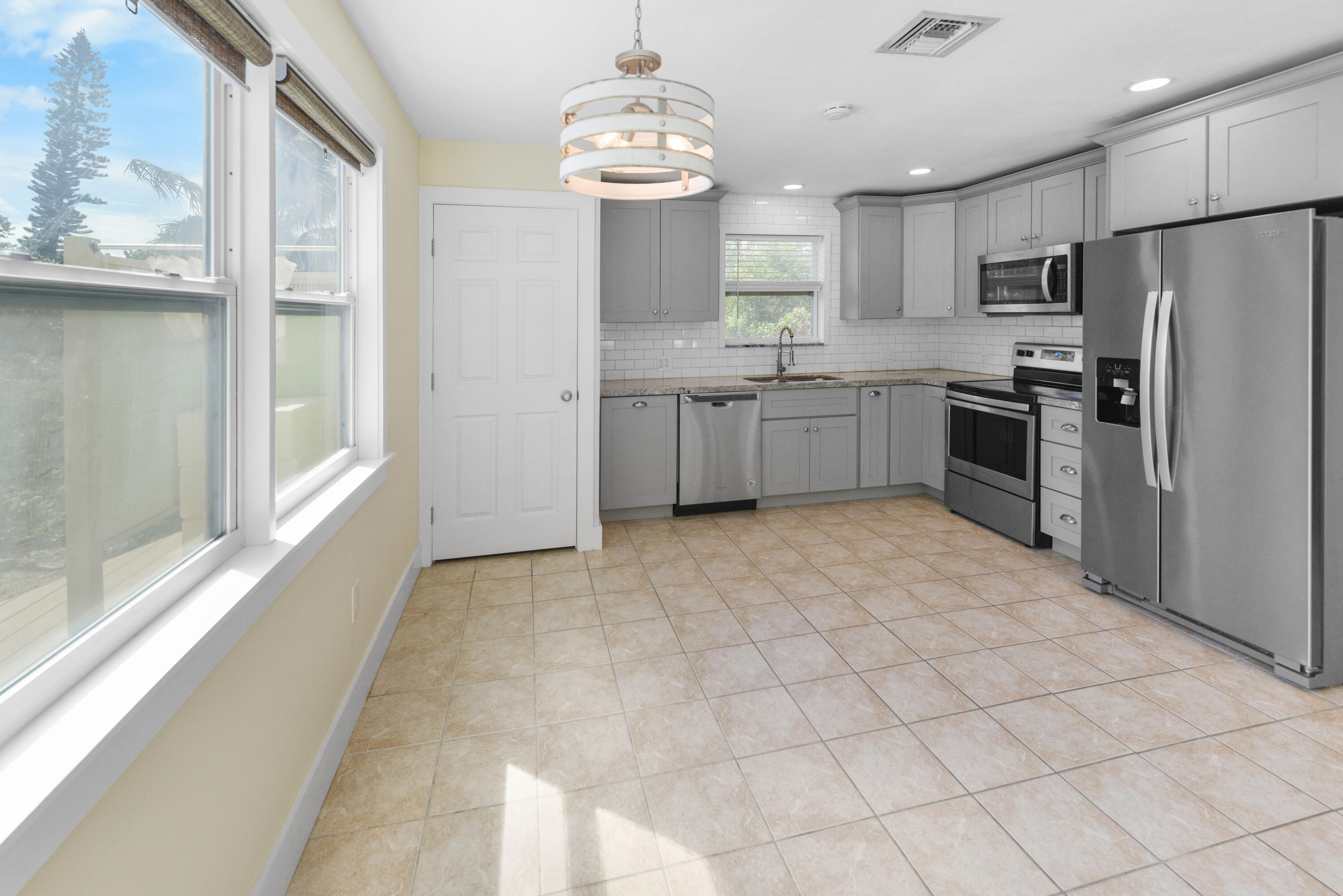 30868 Malaga Lane Big Pine Key, FL 33043 - Photo 20 of 34 a kitchen with stainless steel appliances a sink stove and refrigerator