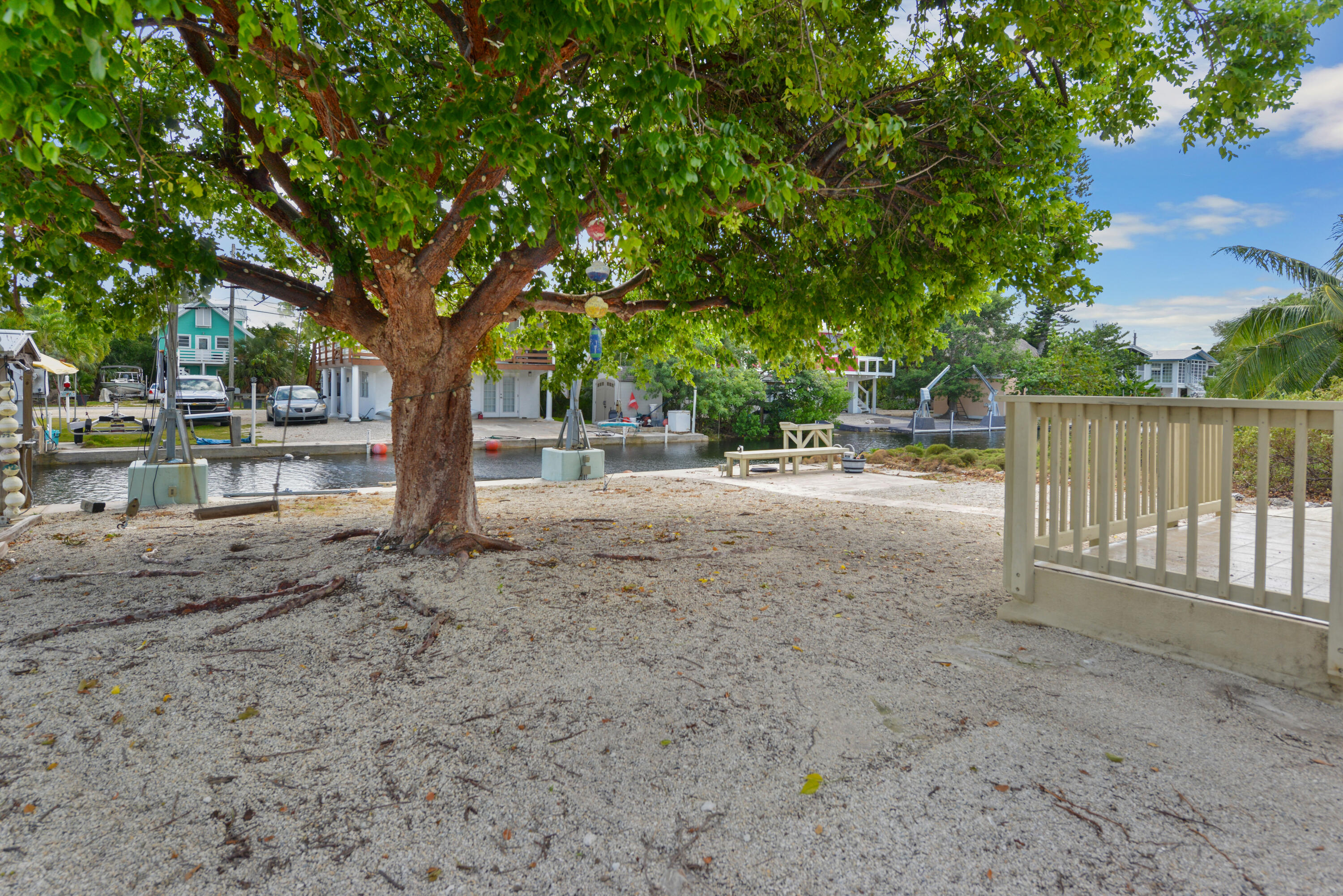 30868 Malaga Lane Big Pine Key, FL 33043 - Photo 26 of 34 a view of backyard with green space and wooden fence