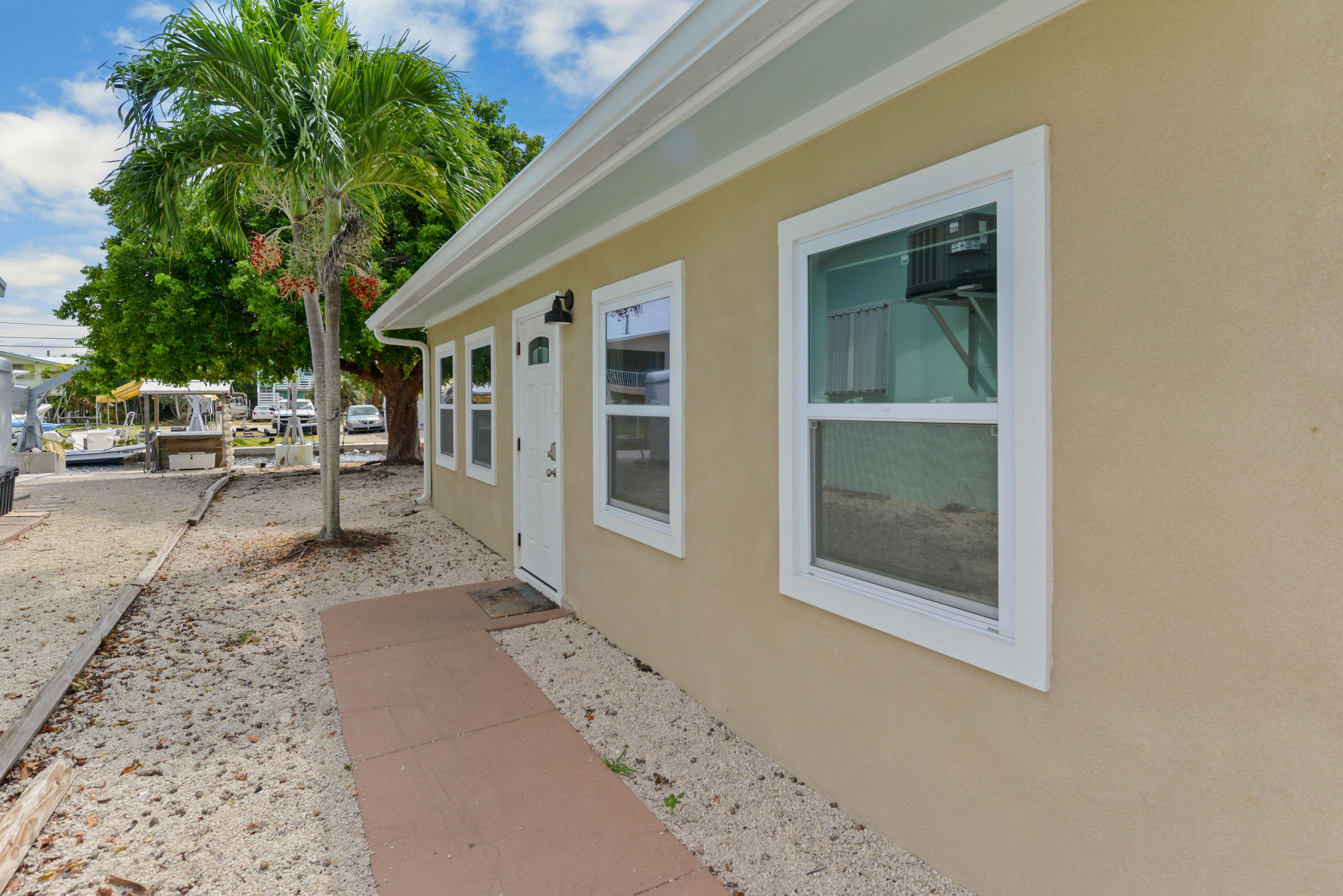 30868 Malaga Lane Big Pine Key, FL 33043 - Photo 4 of 34 a view of a house with backyard and sitting area