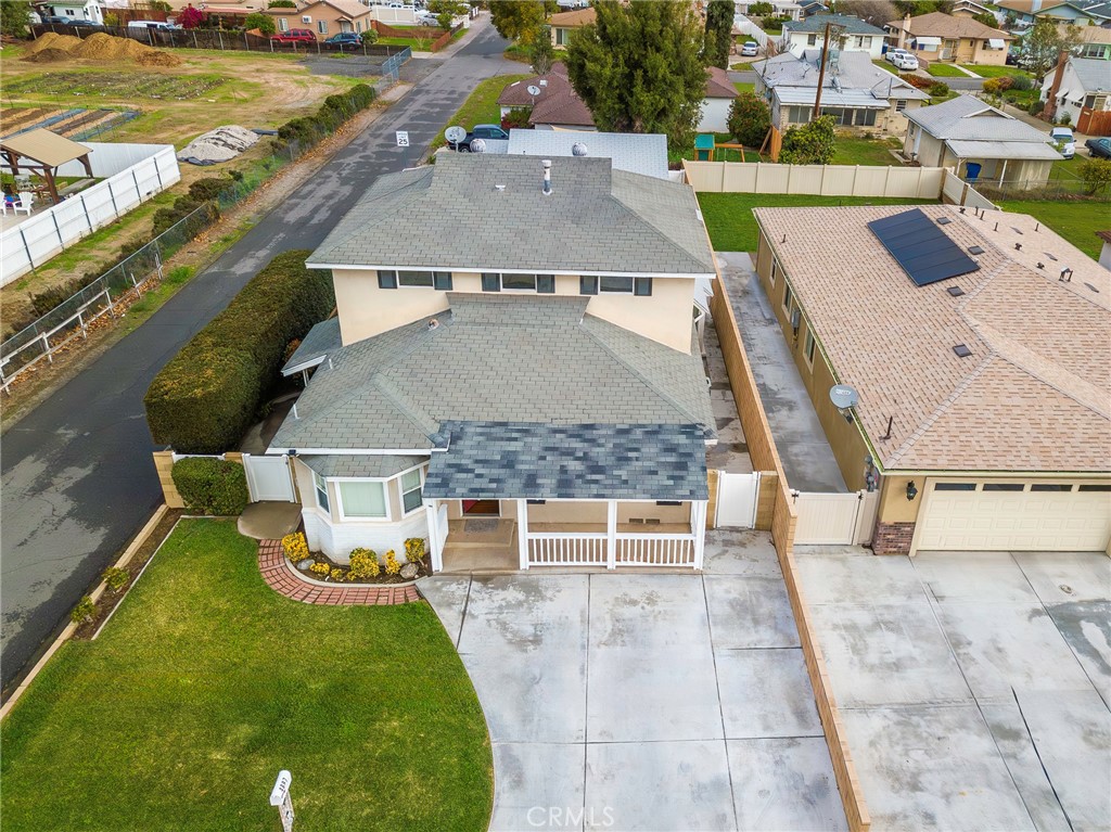 4697 Sierra Street Riverside, CA 92504 - Photo 2 of 51 an aerial view of a house with swimming pool outdoor seating and yard