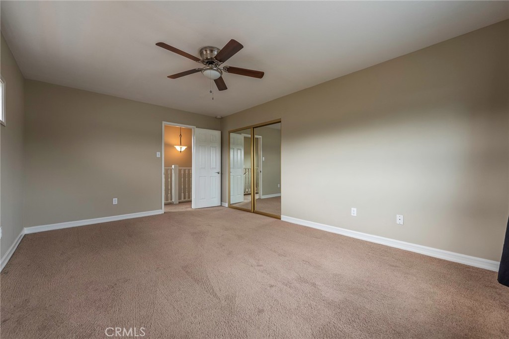 4697 Sierra Street Riverside, CA 92504 - Photo 27 of 51 a view of a livingroom with a ceiling fan and window