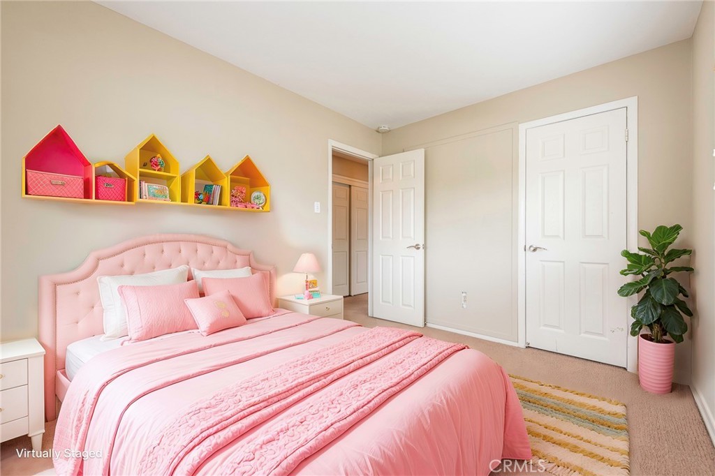 4697 Sierra Street Riverside, CA 92504 - Photo 28 of 51 a bedroom with a bed and a potted plant