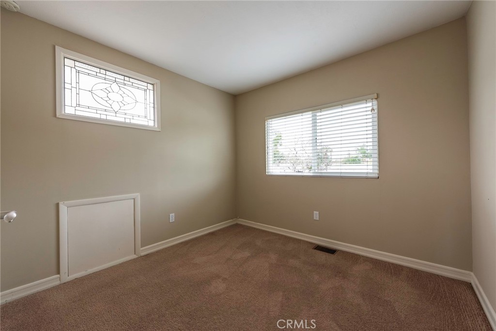 4697 Sierra Street Riverside, CA 92504 - Photo 30 of 51 an empty room with windows