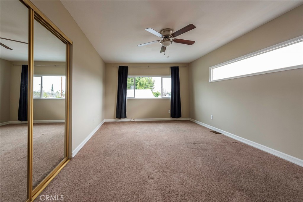 4697 Sierra Street Riverside, CA 92504 - Photo 31 of 51 a view of a livingroom with a ceiling fan and window