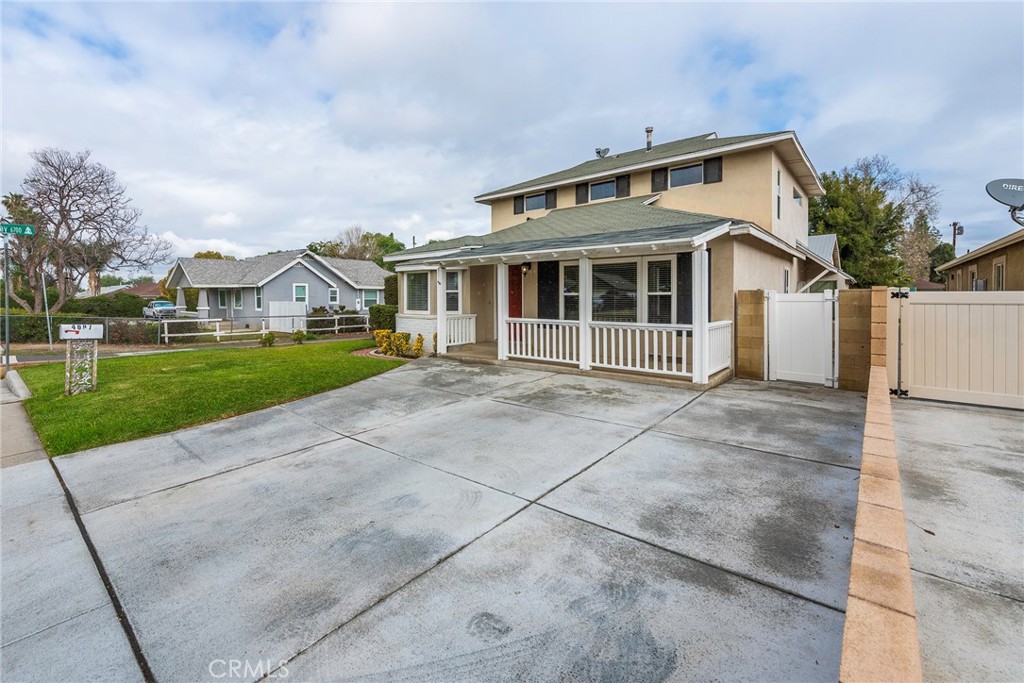 4697 Sierra Street Riverside, CA 92504 - Photo 4 of 51 a front view of a house with a garden