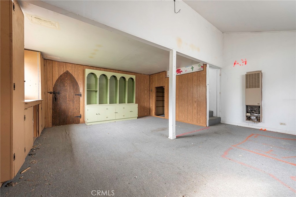 4697 Sierra Street Riverside, CA 92504 - Photo 46 of 51 an empty room with windows and cabinet