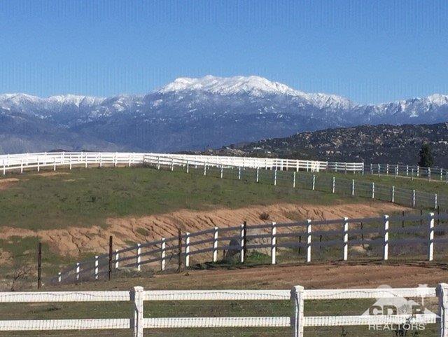 34480 Sycamore Springs Road Hemet, CA 92544 - Photo 11 of 24 a view of a lake with a mountain in the background
