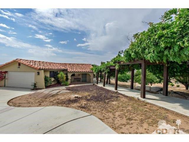 34480 Sycamore Springs Road Hemet, CA 92544 - Photo 24 of 24 a backyard of a house with lots of green space