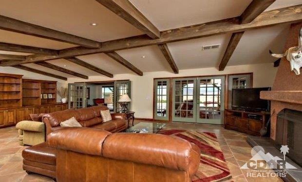 34480 Sycamore Springs Road Hemet, CA 92544 - Photo 5 of 24 a living room with furniture a fireplace and a flat screen tv