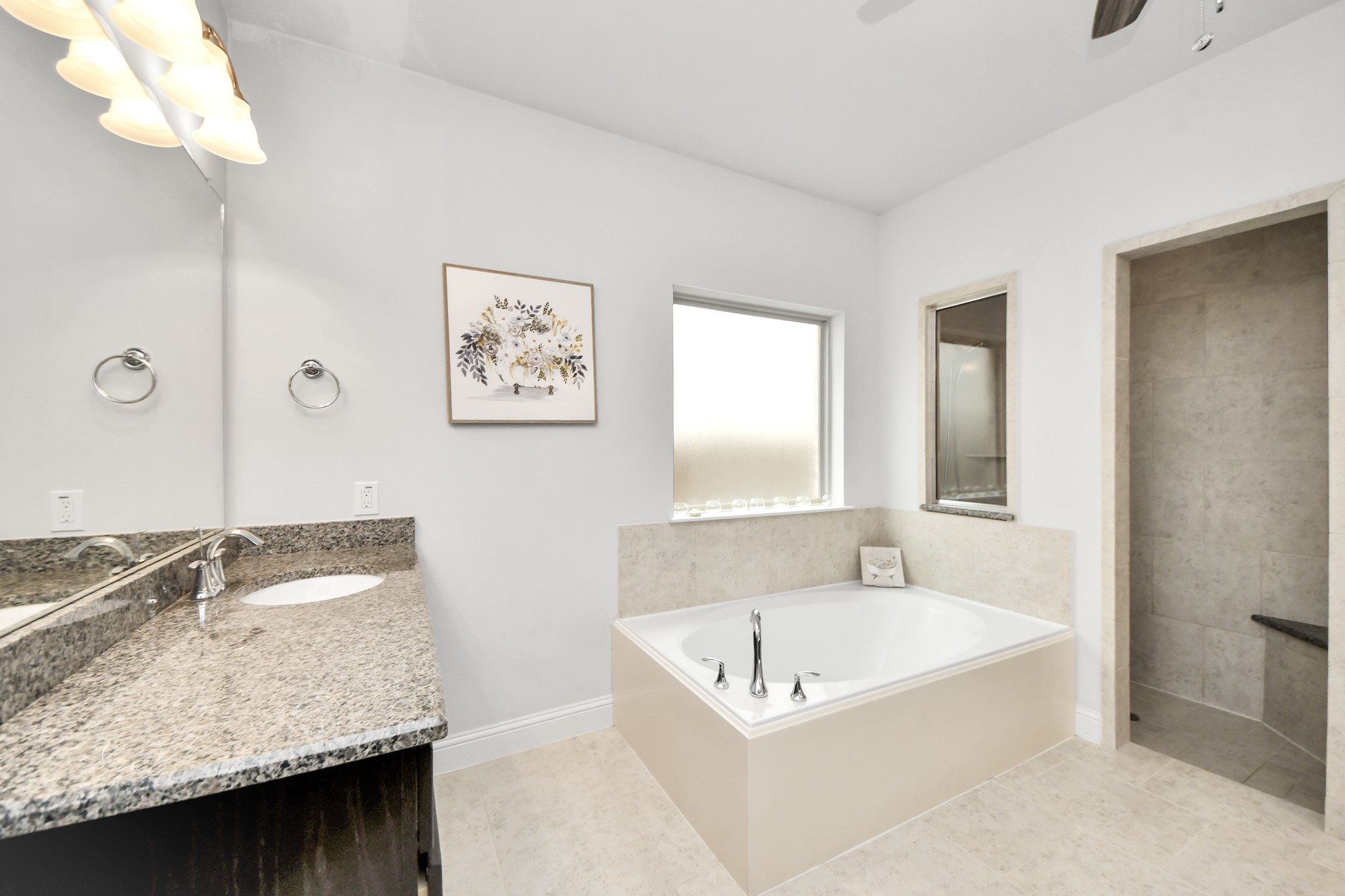 2811 Hadley Springs Lane Spring, TX 77386 - Photo 22 of 50 a bathroom with a granite countertop tub sink and mirror