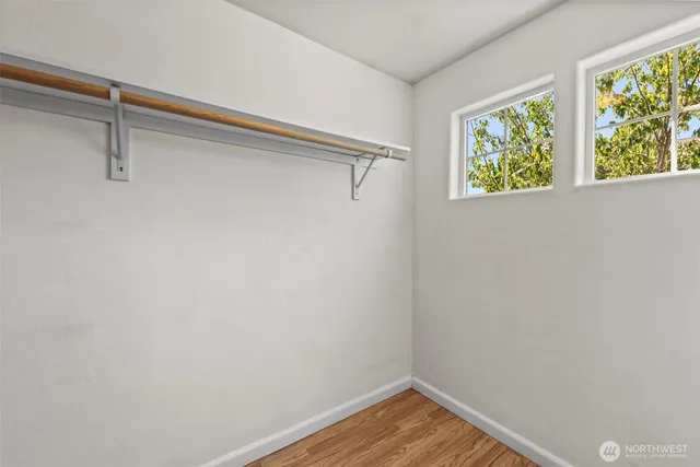 a view of walk in closet with window