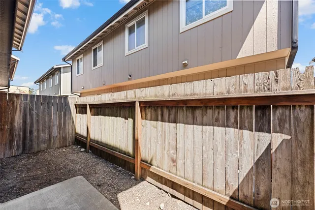 a view of wooden house with wooden stairs