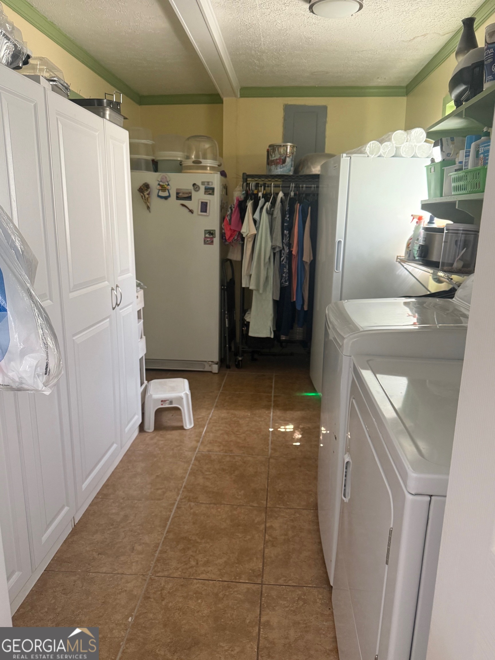 45 Elton Street Hazlehurst, GA 31539 - Photo 12 of 14 a view of walk in closet with clothes and shoes