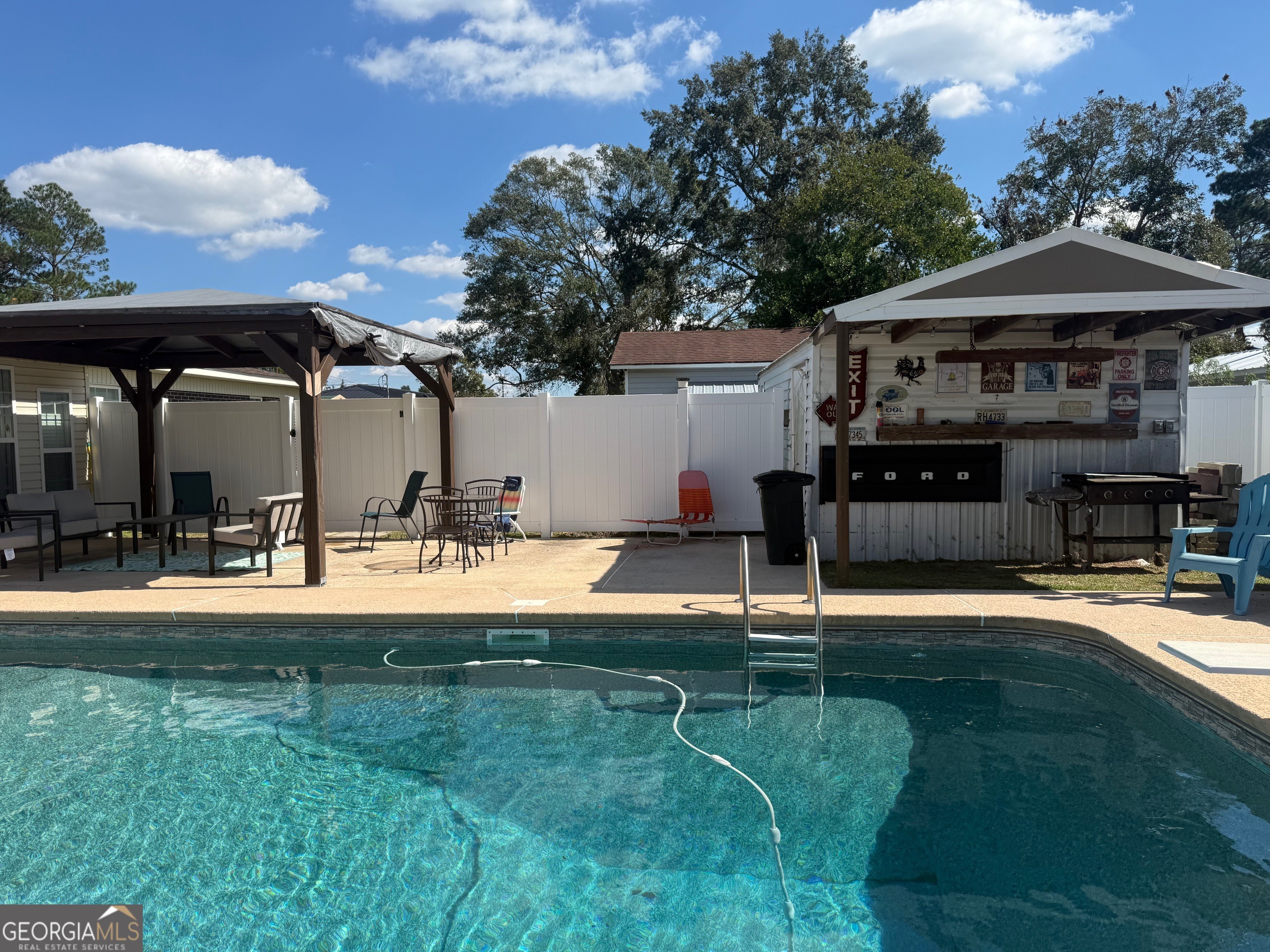 45 Elton Street Hazlehurst, GA 31539 - Photo 14 of 14 a view of a house with swimming pool and sitting area