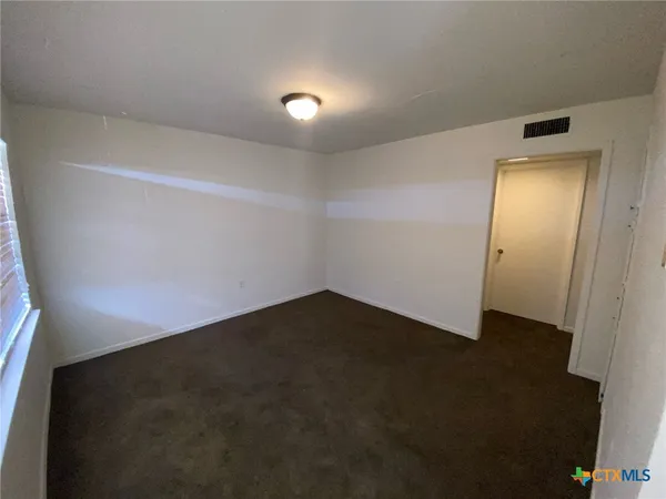 an empty room with a hallway