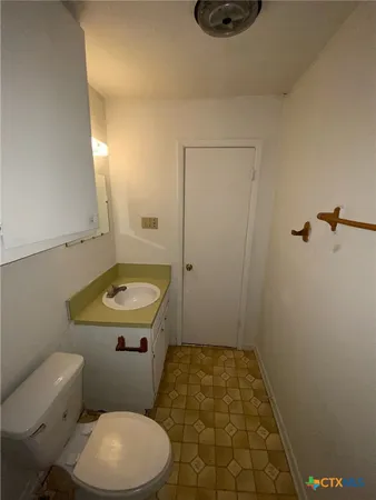 a bathroom with a sink and a toilet