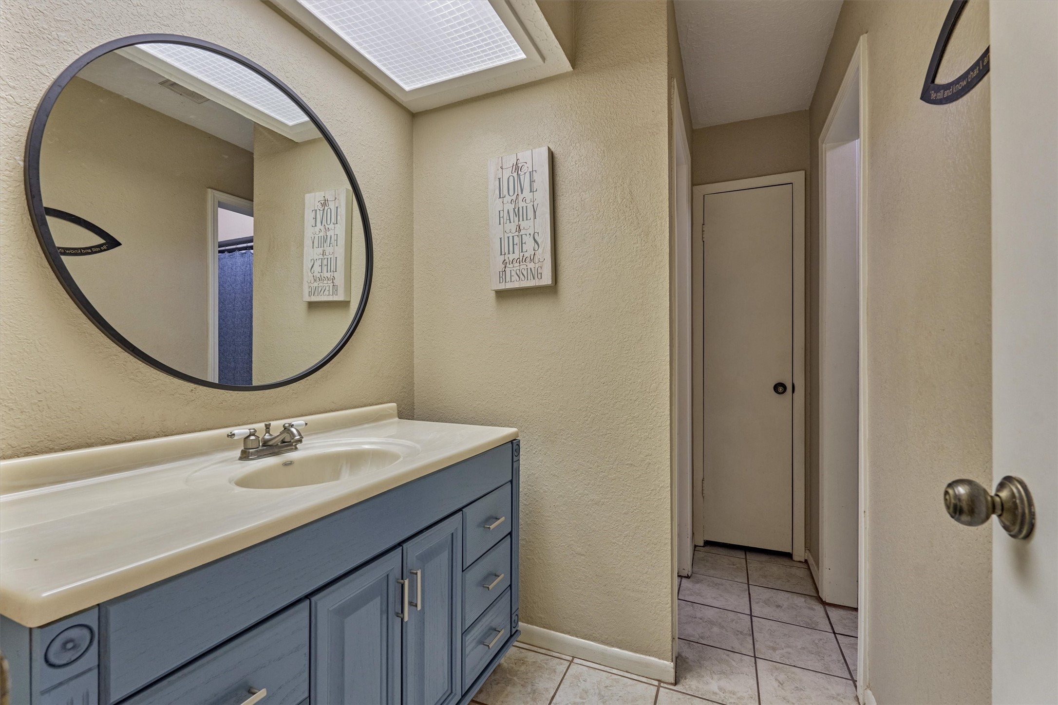 39 Regency Point Conroe, TX 77356 - Photo 11 of 44 a bathroom with a sink and a mirror