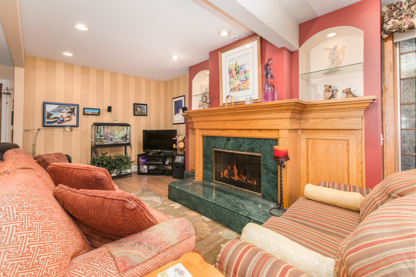 1605 South Fairview Avenue Park Ridge, IL 60068 - Photo 11 of 31 a living room with furniture a flat screen tv and a fireplace