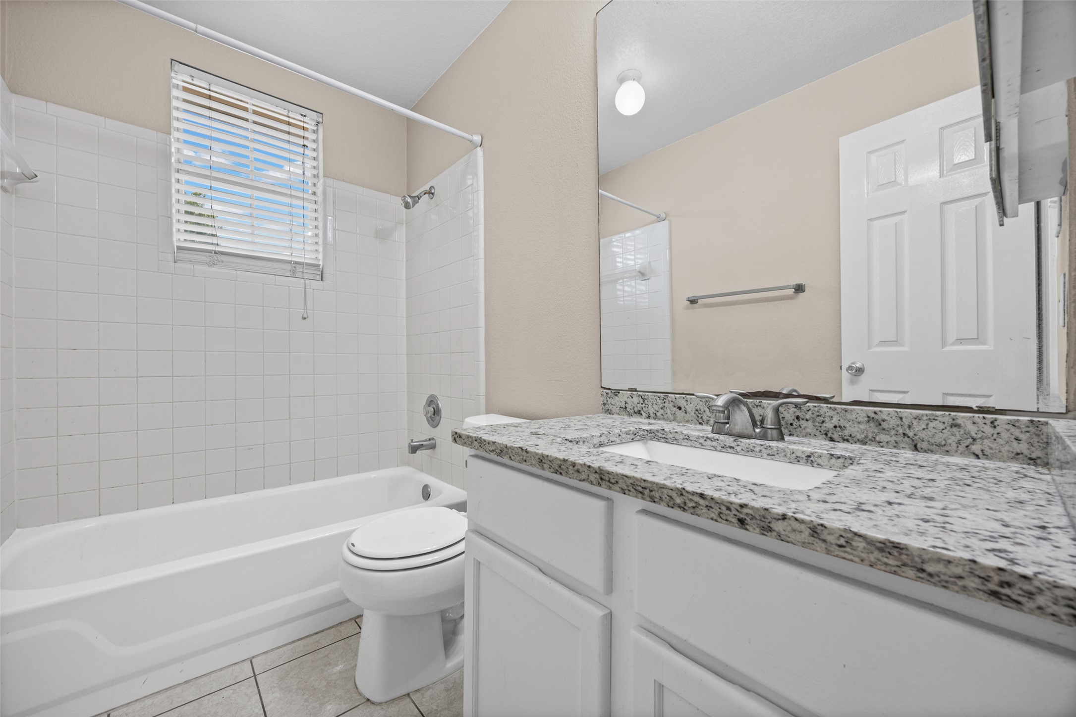 2432 Roundabout Lane Round Rock, TX 78664 - Photo 19 of 22 A pristine bathroom features a classic bathtub and an elegant vanity with ample counter space.