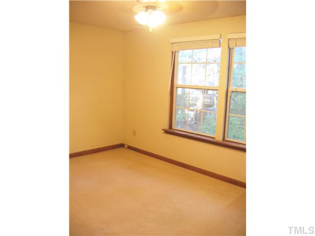 7334 Shellburne Drive Raleigh, NC 27612 - Photo 11 of 19 a view of an empty room with a window