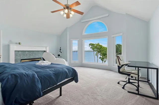 a room with pool table and windows