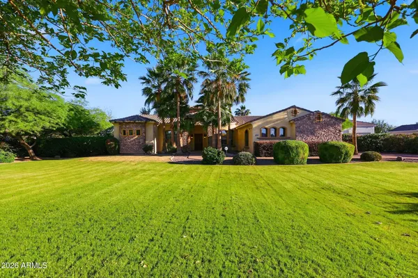 a kitchen with a stove a refrigerator and a dining table