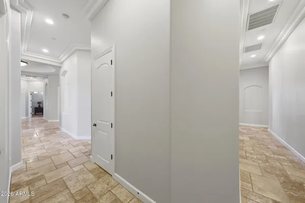 a bathroom with a granite countertop toilet sink and mirror
