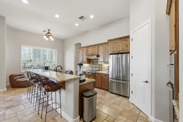 an aerial view of a house with a yard and garden