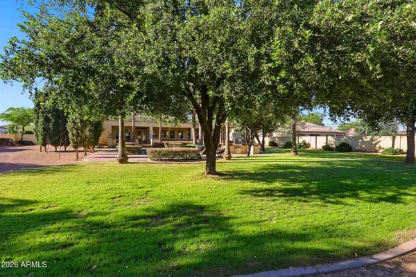a front view of a house with a yard and a garage