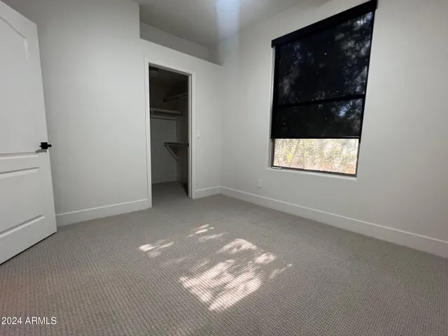 a bathroom with a double vanity sink a mirror and shower