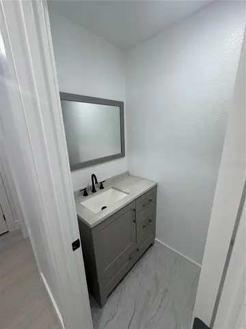 an empty room with a empty space and windows