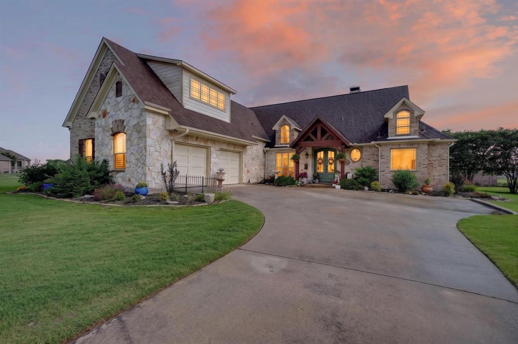 1399 Canyon Lake Road Wills Point, TX 75169 - Photo 1 of 37 a front view of a house with a yard