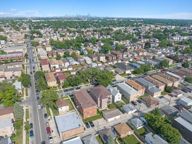 an aerial view of residential houses with outdoor space