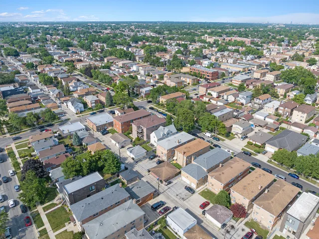 an aerial view of a city with lots of residential buildings