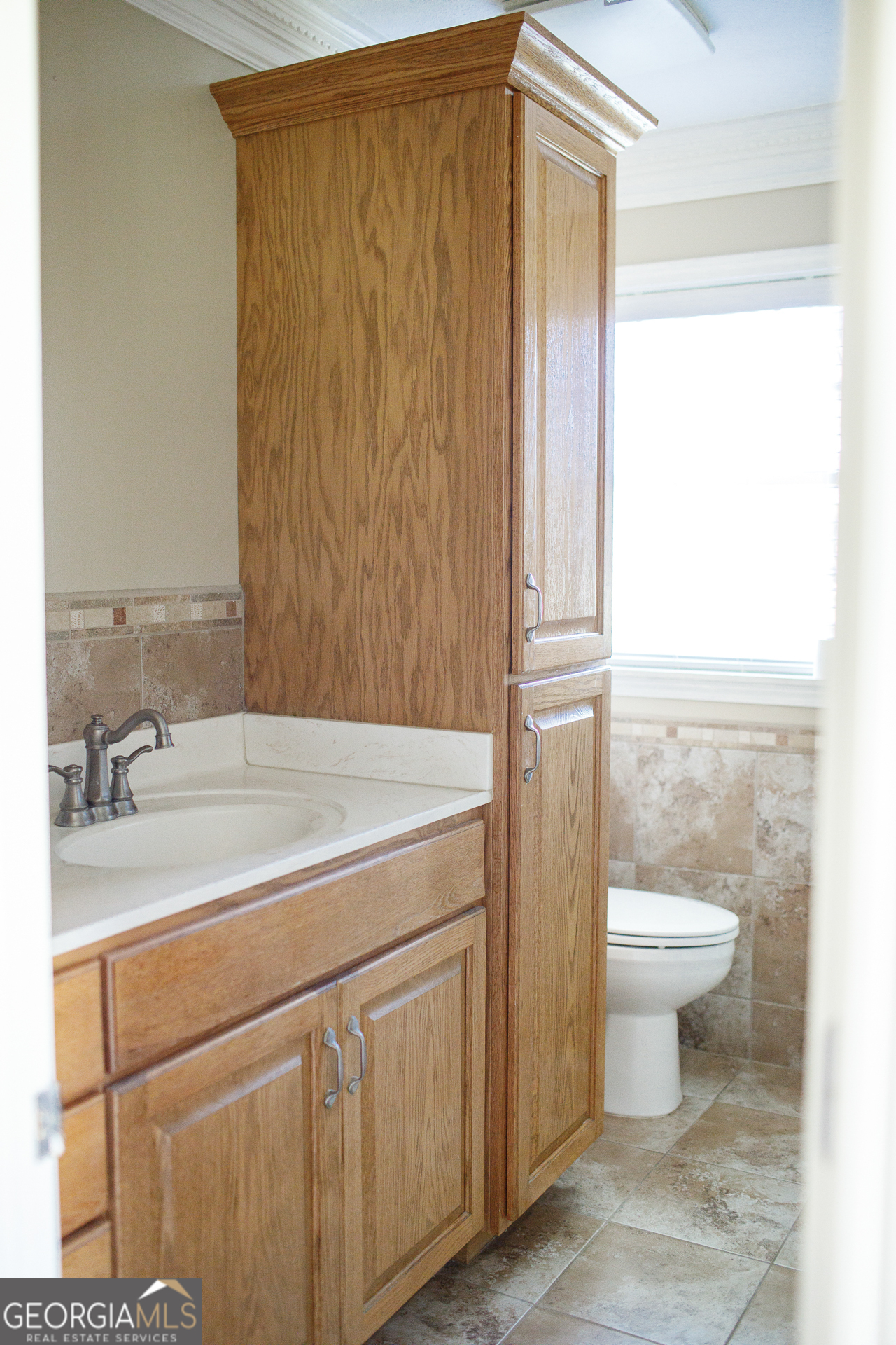 2110 Ware Street Blackshear, GA 31516 - Photo 47 of 57 a bathroom with a granite countertop sink toilet and a mirror