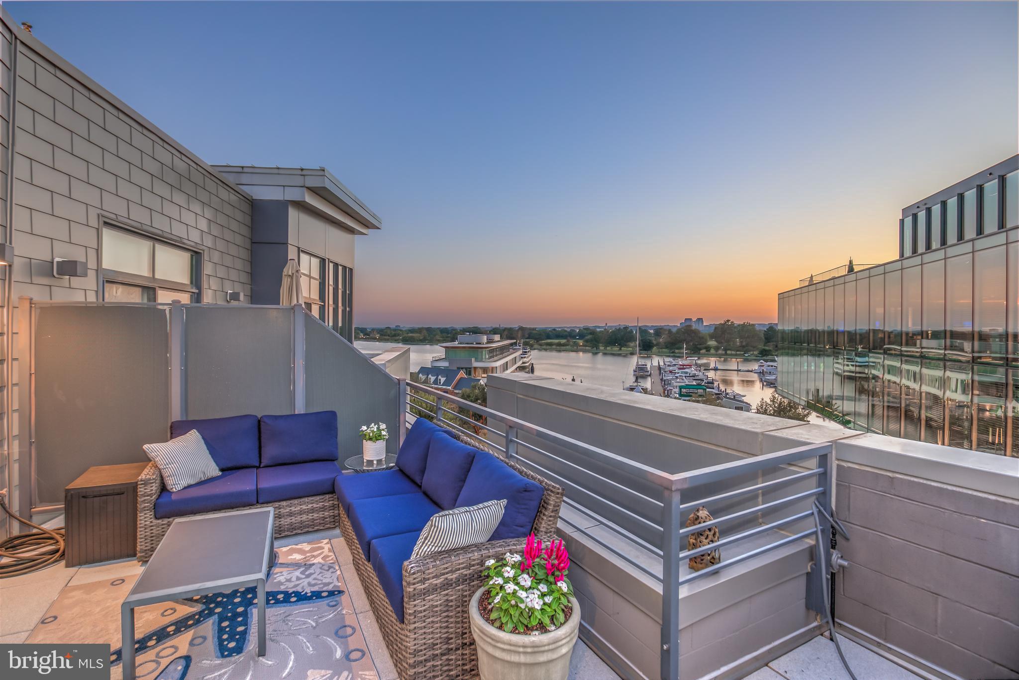 525 Water Street Southwest, Unit 403 Washington, DC 20024 - Photo 1 of 35 a view of a terrace with couches and a potted plant