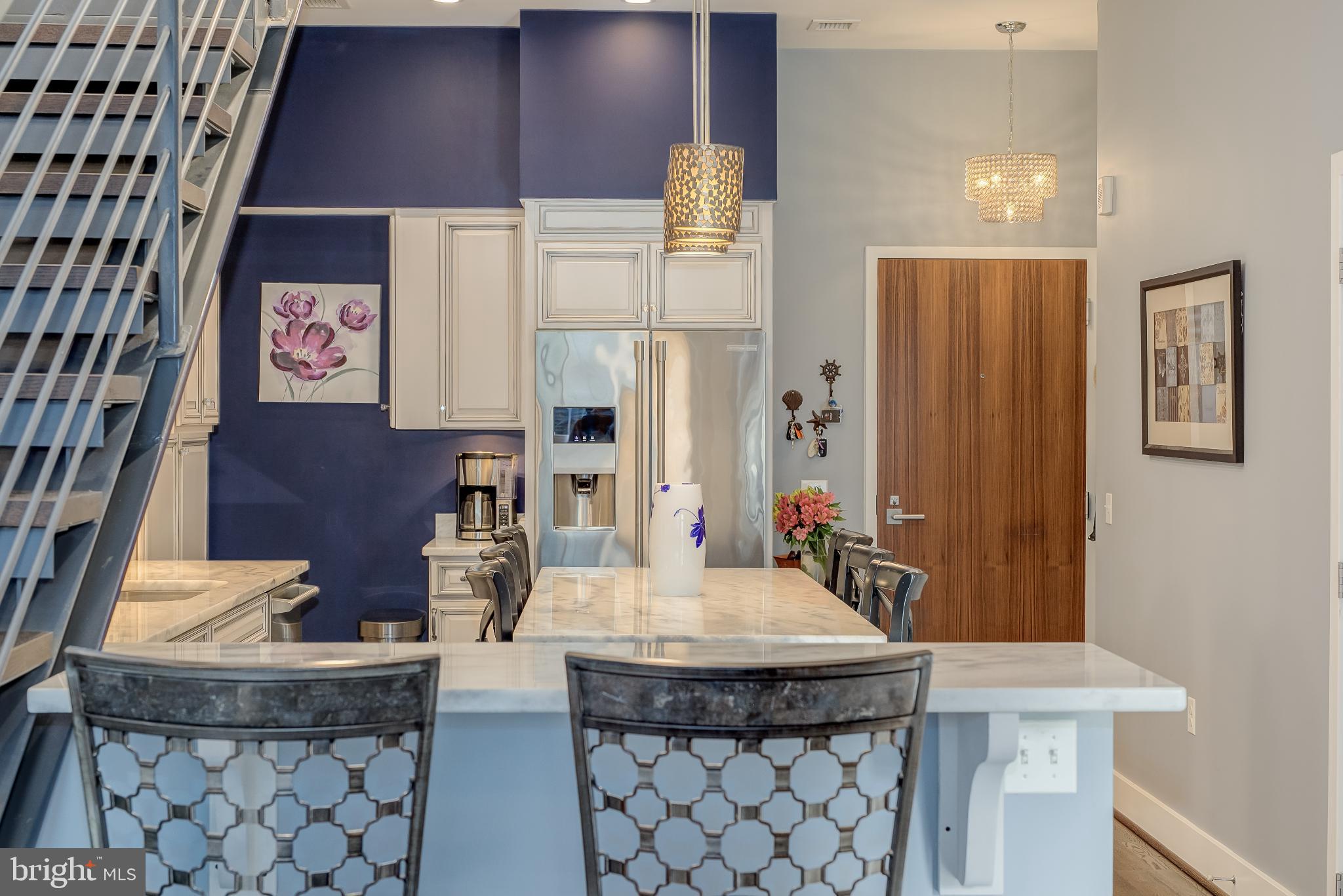525 Water Street Southwest, Unit 403 Washington, DC 20024 - Photo 11 of 35 a kitchen with a table and chairs