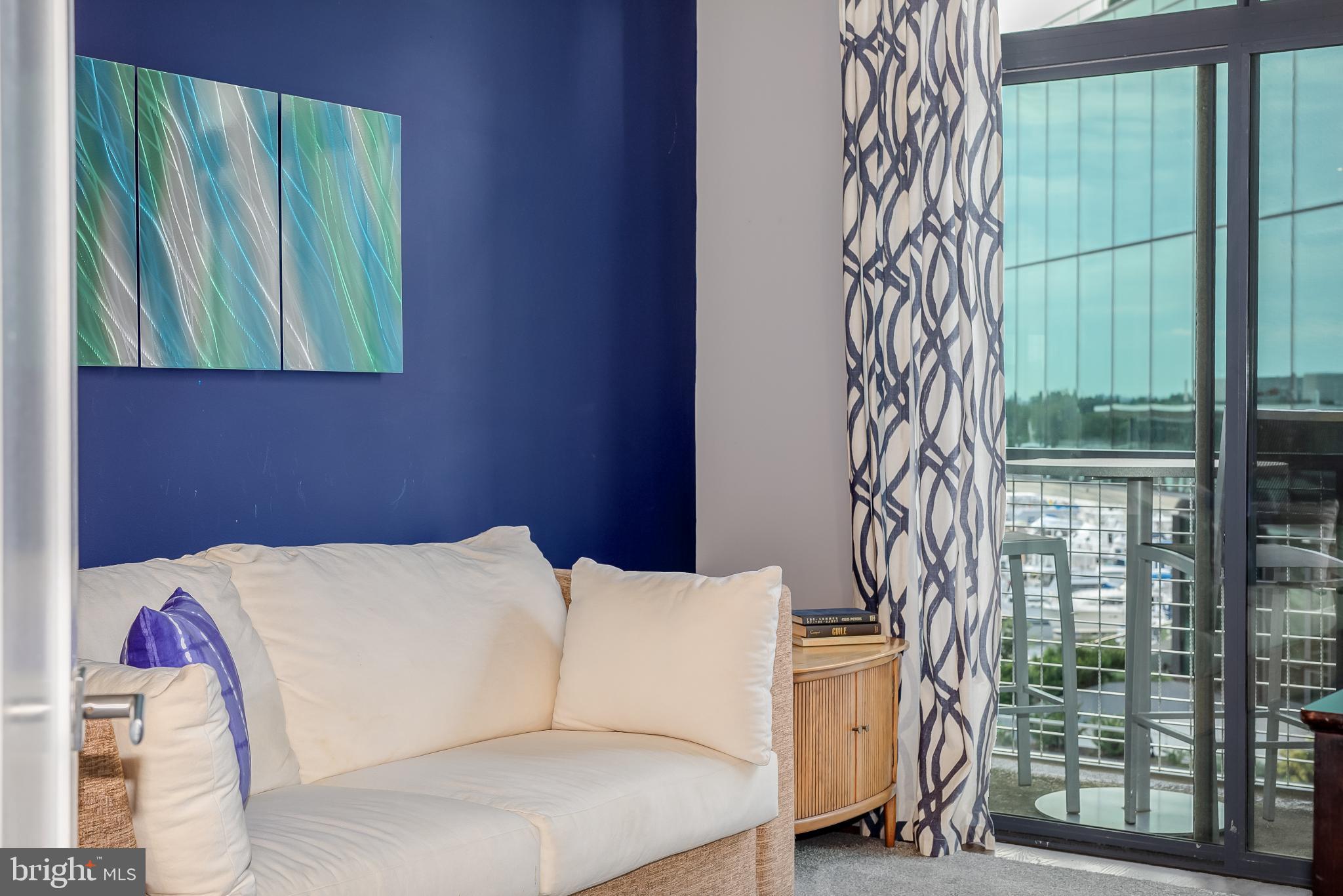 525 Water Street Southwest, Unit 403 Washington, DC 20024 - Photo 14 of 35 a bedroom with a bed and a window