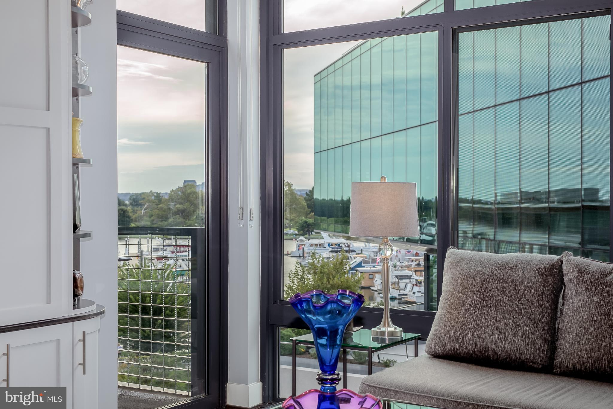 525 Water Street Southwest, Unit 403 Washington, DC 20024 - Photo 18 of 35 a living room with furniture and a window